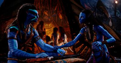 Jake Sully, played by Sam Worthington, left, and Neytiri, played by Zoe Saldana in a scene from Avatar: The Way of Water. Photo: 20th Century Studios