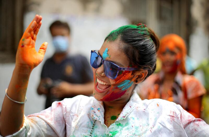Tourists and locals apply colour dust to each other as they celebrate Holi festival in Kolkata, Eastern India. EPA