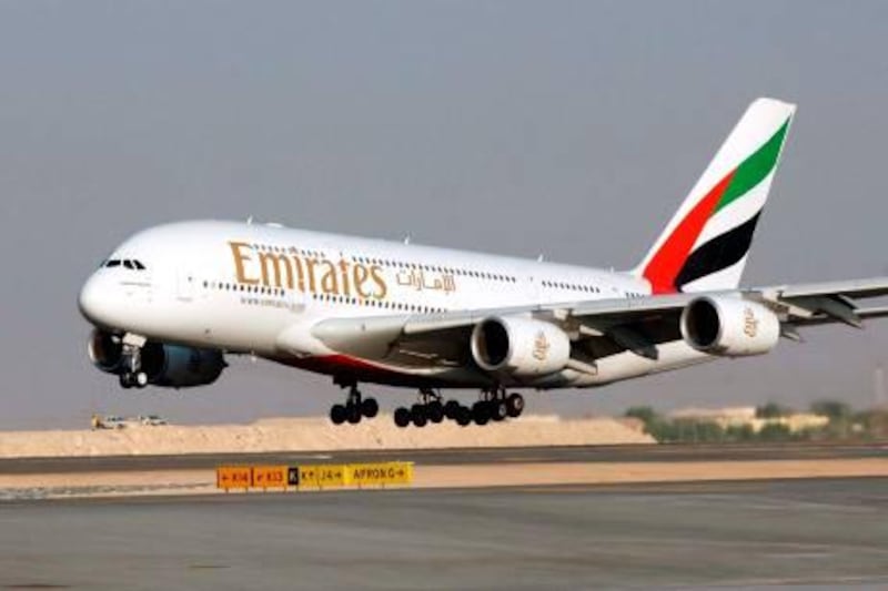 File - In this Nov. 21, 2005 file photo, an Airbus A380 of Emirates Airlines take off for a demonstration flight during the Air show, in Dubai, United Arab Emirates. Emirates airline, the biggest buyer of the "superjumbo" Airbus A380, said Wednesday, Nov. 11, 2009, it is considering increasing its order for the double-decker plane despite delays on existing orders. (AP Photo/Aziz Shah, file) *** Local Caption ***  NYBZ118_Dubai_Airbus.jpg