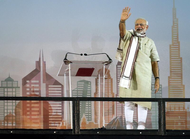 Indian Prime Minister Narendra Modi delivers a speech to members of the Indian expatriate community in the United Arab Emirates at the Dubai Cricket Stadium, on August 17, 2015, during a two-day visit to the UAE. Modi is the first Indian premier to visit the UAE in more than three decades since Indira Gandhi came in 1981 and is due to address the country's large India expat community in Dubai. Indians, who form the UAE's largest expatriate community, account for about 30 percent of the country's population of eight million, with many of them labourers who were behind the construction boom.  AFP PHOTO / KARIM SAHIB / AFP PHOTO / KARIM SAHIB