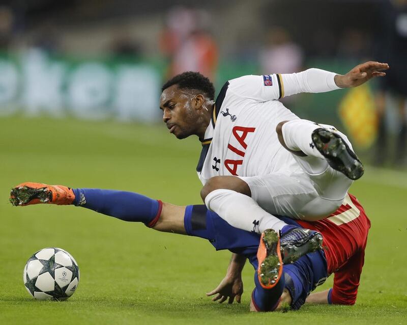 Tottenham's Danny Rose and CSKA's Zoran Tosic fall while fighting for possession. Frank Augstein / AP