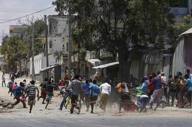 Civilians flee as Somali security forces battle Al Shabab fighters who stormed a government building after exploding a car bomb in central Mogadishu, one of a series of attacks the extremist group has carried out in the Somali capital. EPA