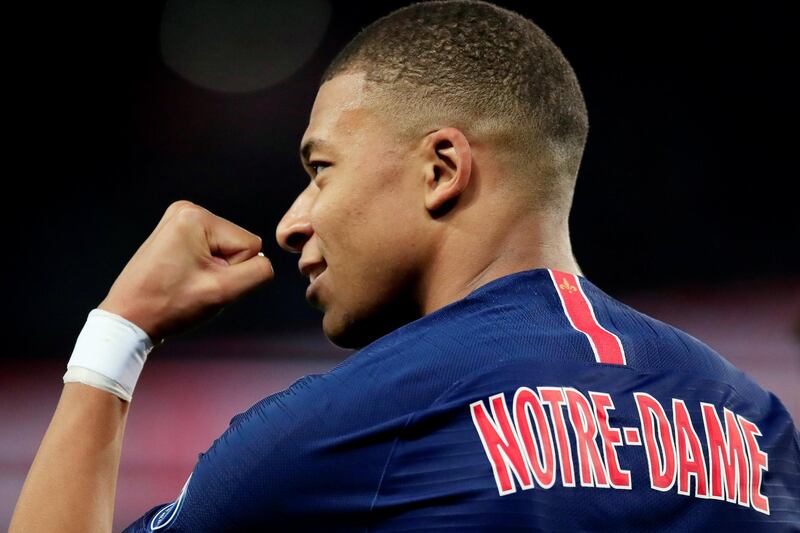 PSG striker Kylian Mbappe celebrates scoring their third goal and completing his hat-trick against Monaco. PSG wore "Notre-Dame" on the back of their shirts in homeage to the iconic Paris cathedral that was badly damaged by fire last week. Reuters