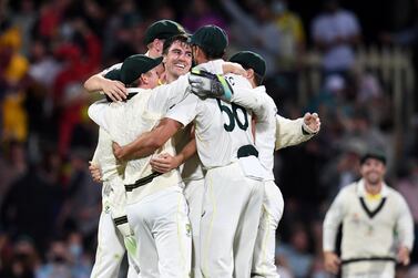 Pat Cummins (centre) of Australia celebrates with team mates after winning the Fifth Ashes Test and the Ashes series on day 3 of the match between Australia and England at Blundstone Arena in Hobart, Australia, 16 January 2022.   EPA / DARREN ENGLAND AUSTRALIA AND NEW ZEALAND OUT