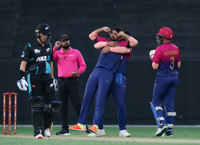 UAE bowler Basil Hameed celebrates after taking the wicket of New Zealand's Tim Seifert.