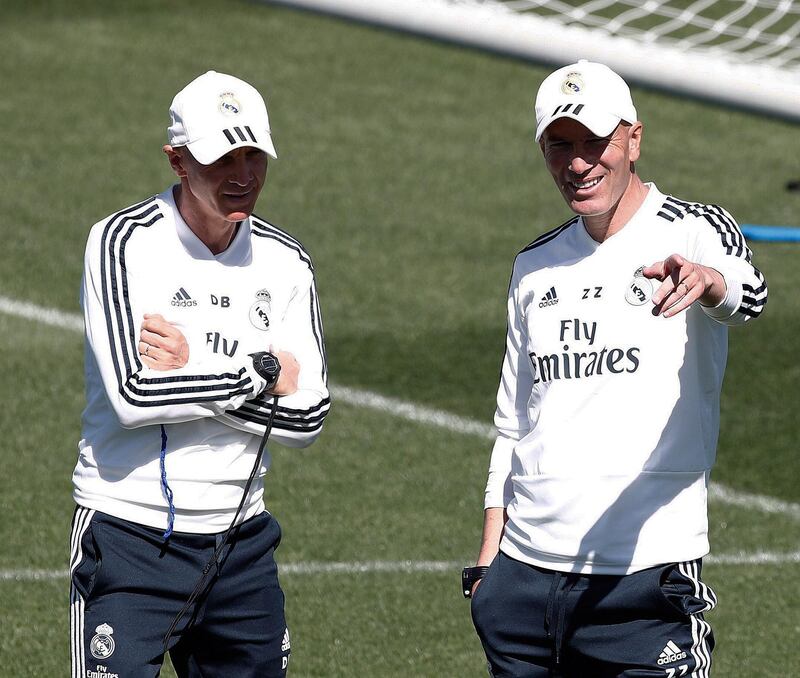 Real Madrid's French head coach, Zinedine Zidane, right, attends the team's training session at Valdebebas sports city in Madrid. EPA