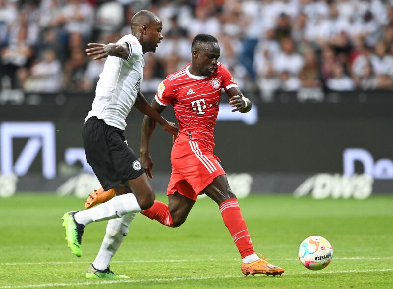 Bayern Munich forward Sadio Mane holds off the challenge of Frankfurt's Evan N'Dicka. AFP