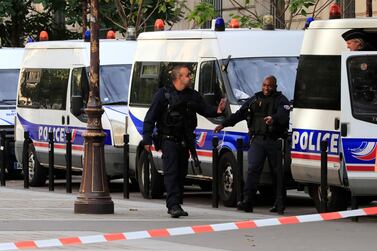 Police officers control an area outside the Paris police headquarters, Thursday, Oct.3, 2019 in Paris. An administrator armed with a knife attacked officers inside Paris police headquarters Thursday, killing four before he was fatally shot. AP Photo/Michel Euler