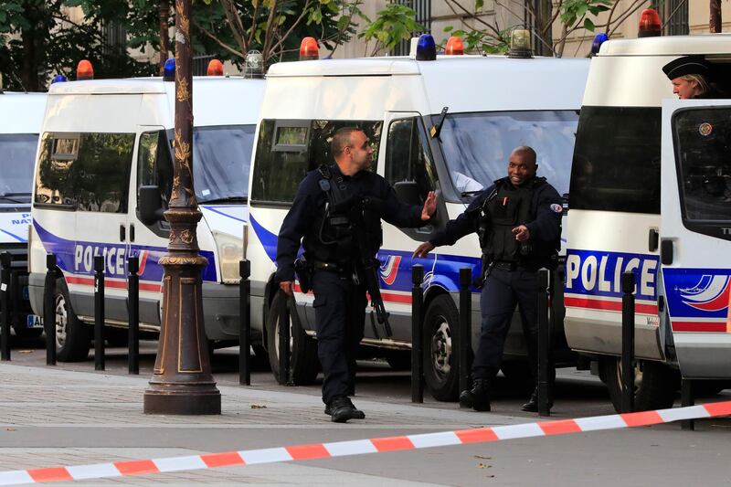 Police officers control an area outside the Paris police headquarters, Thursday, Oct.3, 2019 in Paris. An administrator armed with a knife attacked officers inside Paris police headquarters Thursday, killing at least four before he was fatally shot, officials said. (AP Photo/Michel Euler)