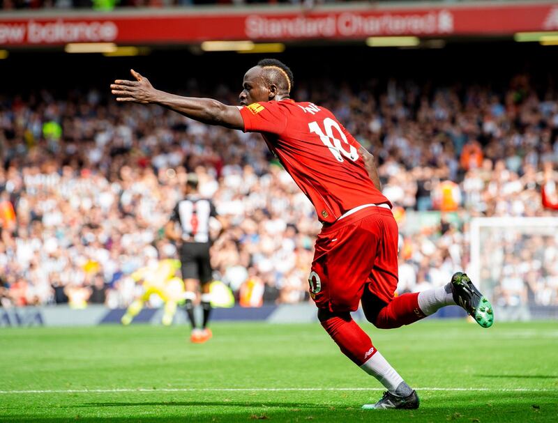 Sadio Mane celebrates scoring Liverpool's equaliser against Newcastle United at Anfield. Mane would later go on to score a second goal in a 3-1 win to keep Liverpool top of the Premier League. EPA