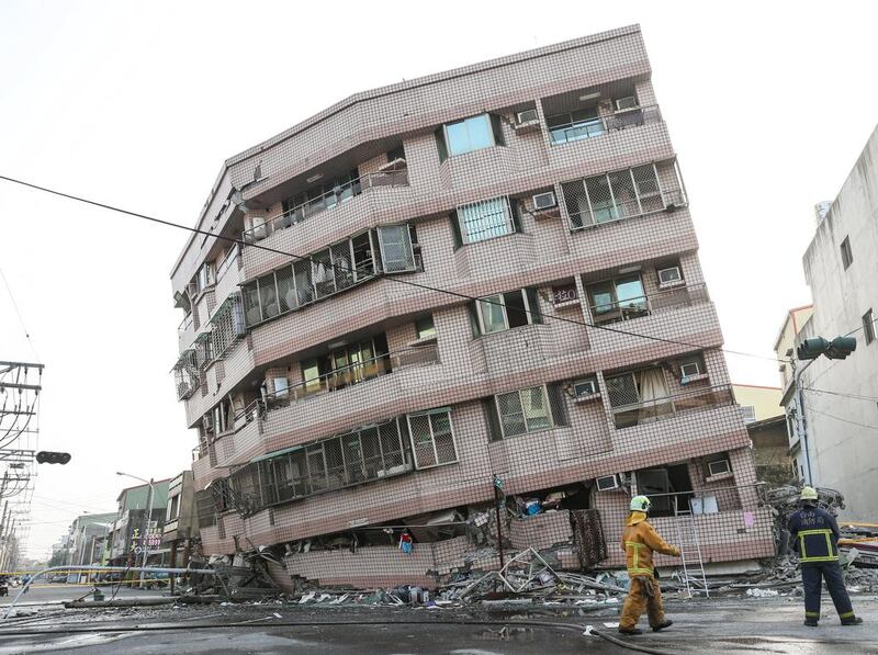 A damaged building is seen after a powerful earthquake hit Tainan, Southern Taiwan on Saturday. The city government said that 24 of the 26 confirmed deaths were from the building collapse. Stringer / Reuters