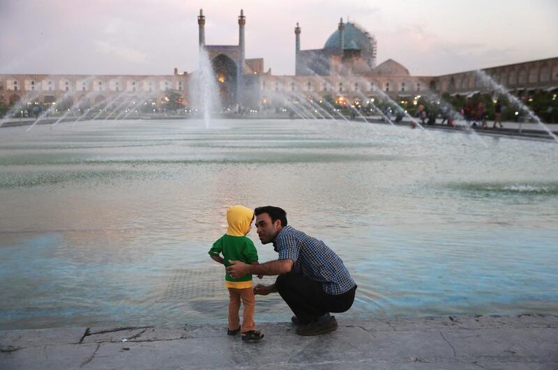  A father and son spend dusk together in the Unesco-listed Naqsh-eJanan Square Isfahan.