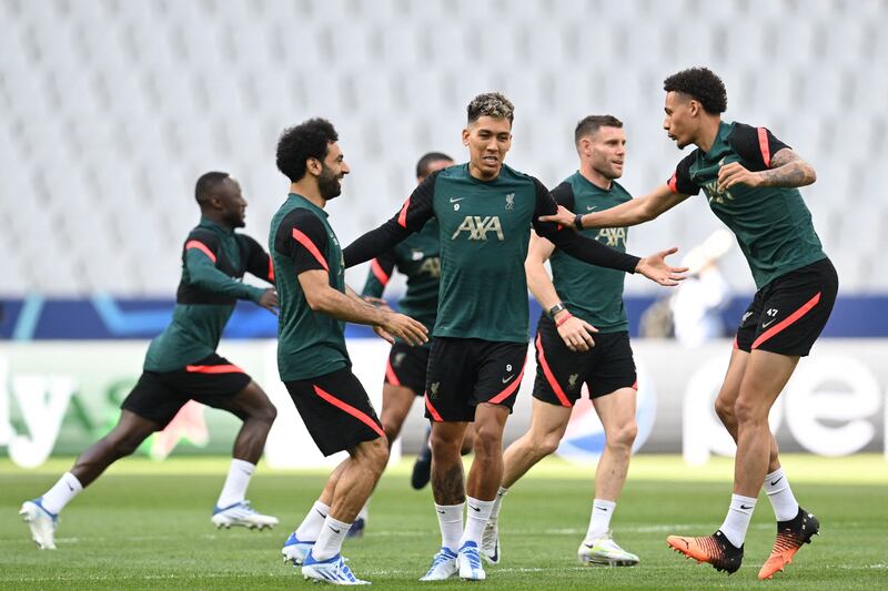 Mohamed Salah, Roberto Firmino, and Nathaniel Phillips train at the Stade de France. AFP