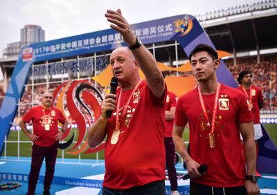 Head coach of China's Guangzhou Evergrande Luiz Felipe Scolari (C) speaks after their match against Tianjin Quanjian in the Chinese Super League (CSL) football league in Guangzhou, in China's southern Guangdong province on November 4, 2017.
Luiz Felipe Scolari thanked the Guangzhou Evergrande players and fans on November 4, after what is expected to be his final game in charge at the freshly crowned Chinese Super League (CSL) champions. / AFP PHOTO / STR / China OUT