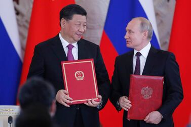 Chinese President Xi Jinping and Russian President Vladimir Putin attend a signing ceremony following their talks at the Kremlin. EPA, pool