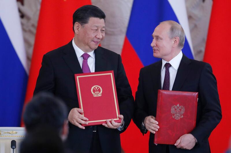 epa07627963 Chinese President Xi Jinping (L) and Russian President Vladimir Putin (R) attend a signing ceremony following their talks at the Kremlin in Moscow, Russia, 05 June 2019. Chinese President is on a state visit in Russia.  EPA/MAXIM SHIPENKOV/POOL / POOL
