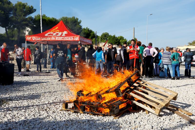 A TotalEnergies and Esso ExxonMobil workers' protest outside TotalEnergies refinery in La Mede. Reuters