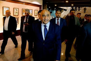 Iraq's new prime minister Adel Abdul Mahdi, centre, leaves the parliament building in Baghdad, Iraq. AP