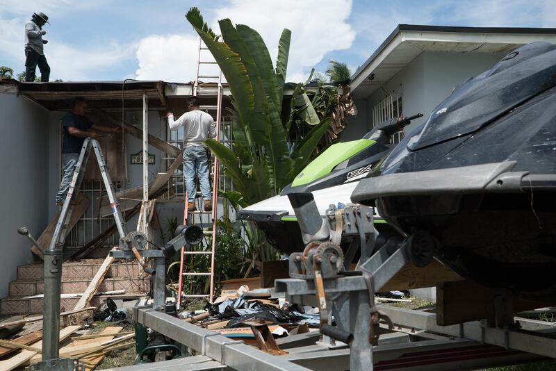 Contractors prepare a home ahead of the arrival of Hurricane Irma in Miami, Florida. Jayme Gershen / Bloomberg