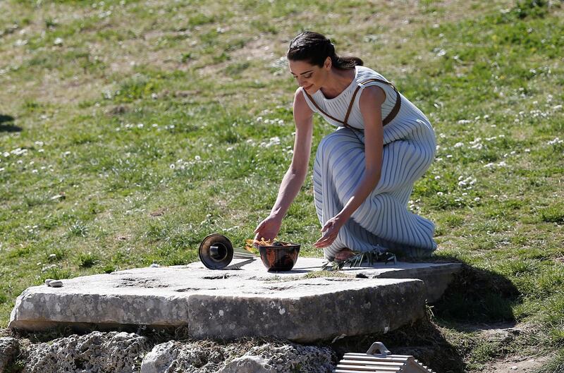 Greek actress Xanthi Georgiou, playing the role of High Priestess lights the flame during the Olympic flame lighting ceremony for the Tokyo 2020 Summer Olympics in Ancient Olympia, Greece. Reuters