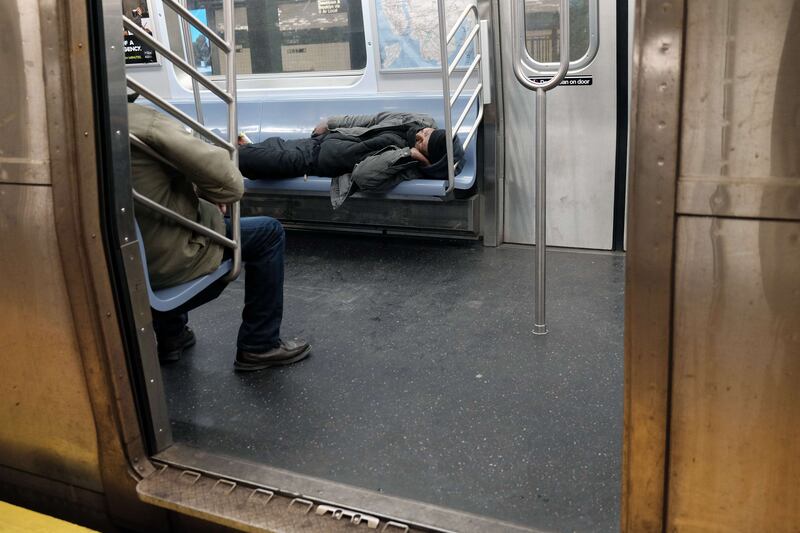 Many homeless people sleep in the city's vast subway system and trains on cold nights. Getty Images / AFP