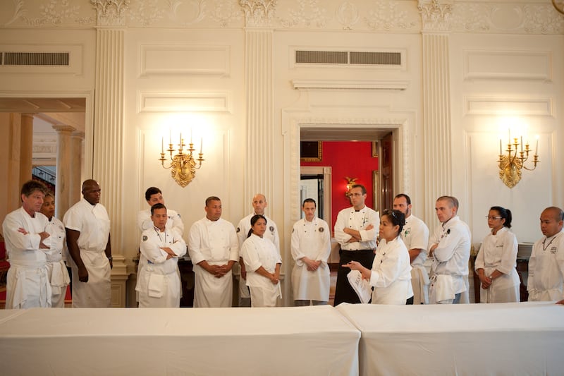 Ms Comerford, foreground, briefs staff on preparations for a state dinner honouring Mexico in 2010. Photo: Official White House Photo / Samantha Appleton