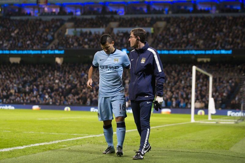 Manchester City's Sergio Aguero walks off injured during his side's Premier League win against Everton on Saturday. Jon Super / AP / December 6, 2014  