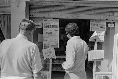 Syrians read newspaper headlines on October 7, 1973, at the start of the 1973 Arab–Israeli War. AFP