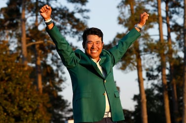 Japan's Hideki Matsuyama celebrates with his green jacket after winning The Masters. Reuters