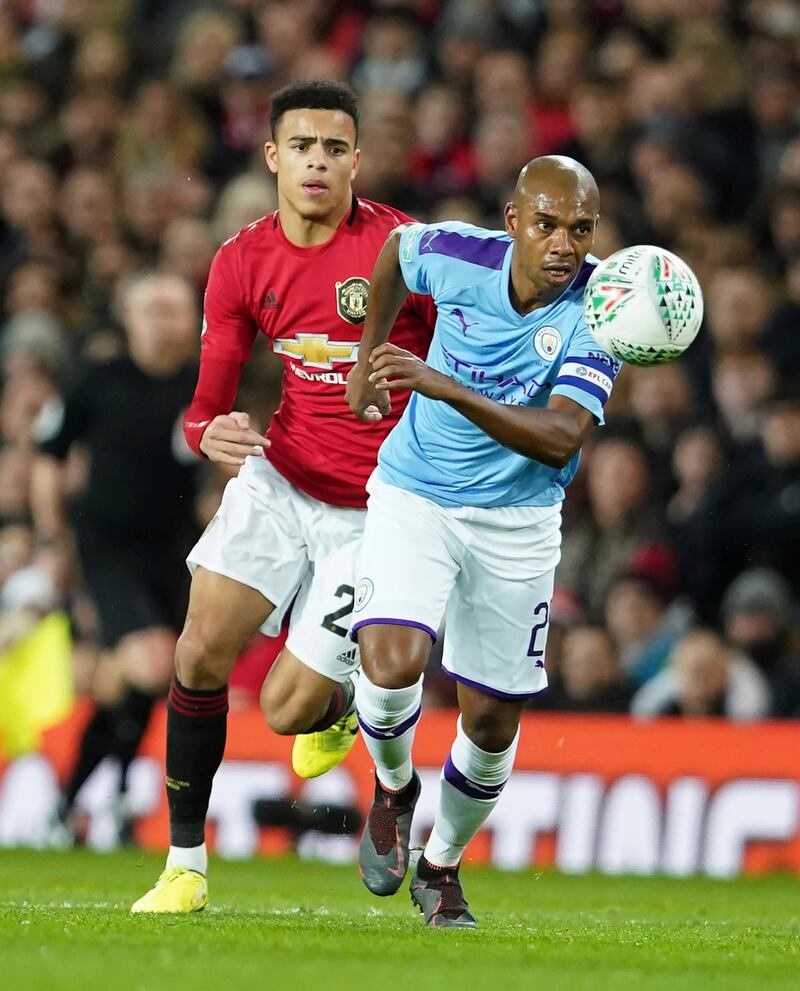 Manchester City's Fernandinho, right, vies for the ball with Manchester United's Daniel James during the League Cup semi-final first leg  at Old Trafford. AP