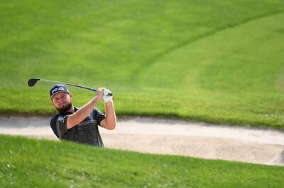 DUBAI, UNITED ARAB EMIRATES - NOVEMBER 19:  Tyrrell Hatton of England hits a bunker shot  during practice prior to the DP World Tour Championship Dubai at Jumeirah Golf Estates on November 19, 2019 in Dubai, United Arab Emirates. (Photo by Ross Kinnaird/Getty Images)