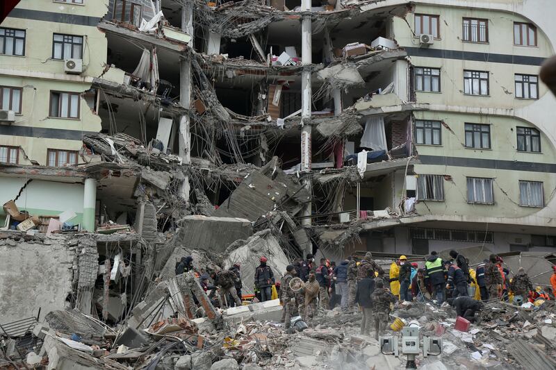 Rescue workers search for survivors under the rubble in Diyarbakir. Reuters