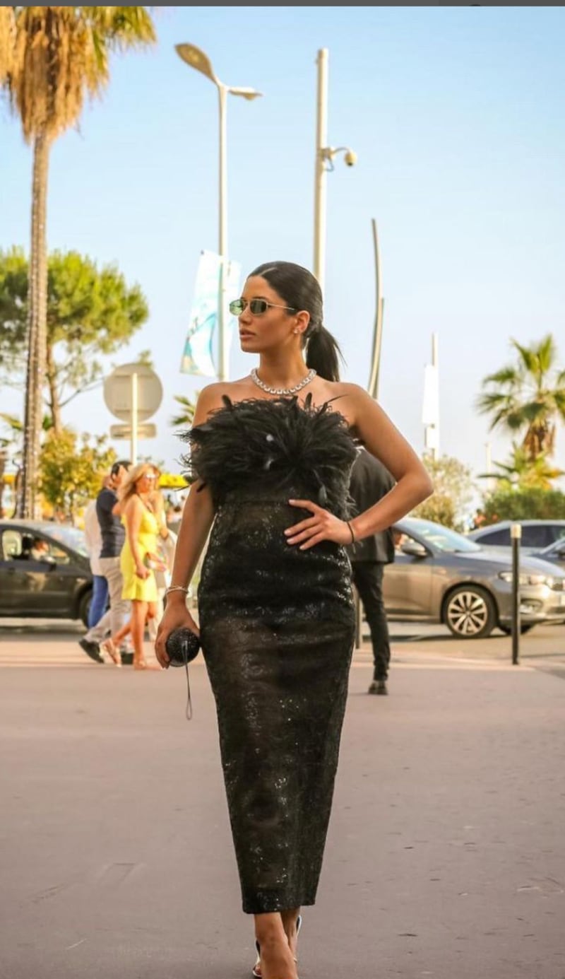 Cynthia Khalifeh in a lace-fitted dress in chic black, topped with feathers, from the ready-to-wear autumn-winter 2022 collection. Photo: Rami Al Ali