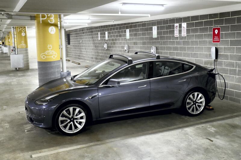 SYDNEY, AUSTRALIA - JANUARY 19: A Tesla Model Y charges at a EV charge station in Lane Cove on January 19, 2021 in Sydney, Australia. Share prices for lithium miners and battery makers continue to rise as global demand for electric vehicles continues to grow. Lithium is a key component for batteries in electric cars. (Photo by Brendon Thorne/Getty Images)