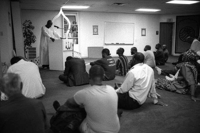 An imam gives a sermon to a group of worshippers after Friday prayers at a mosque in Oklahoma City.