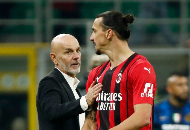 AC Milan coach Stefano Pioli talks to  Zlatan Ibrahimovic after the match. Reuters