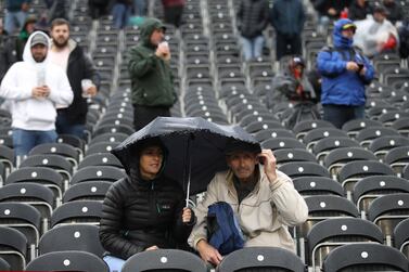 Cricket - Ashes 2019 - Fourth Test - England v Australia - Emirates Old Trafford, Manchester, Britain - September 4, 2019 Spectators with umbrella's during a rain delay Action Images via Reuters/Carl Recine