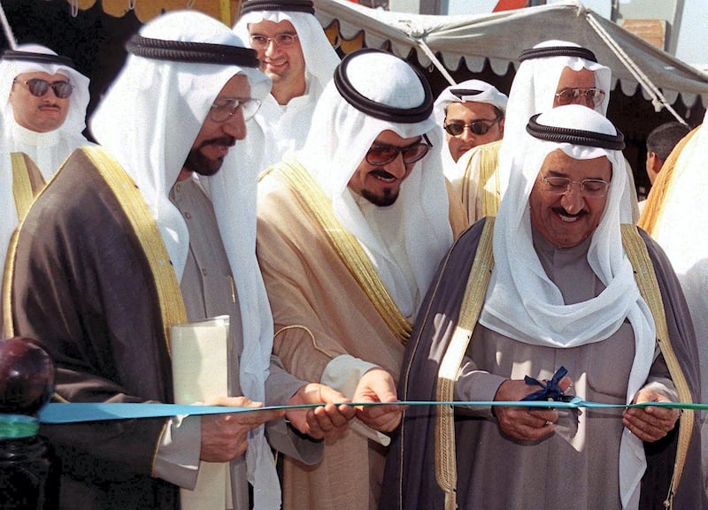 Kuwait's Foreign Minister Sheikh Sabah al-Ahmad al-Sabah (R), Commerce Minister Abdel Wahab al-Wazzan (L) and Finance and Communications Minister Sheikh Ahmad al-Abdallah al-Sabah (C) open the Gulf emirate's free trade zone 22 November 1999. The zone occupies 10 000
square meters of land, more than 60 contracts have already been signed with local and international investors taking up 70 percent of the available spaces. (Photo by RAED QUTENA / AFP)