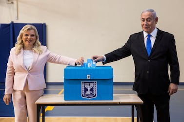 Israeli Prime Minister Benjamin Netanyahu and his wife Sara casts their votes during Israel's parliamentary election. Reuters