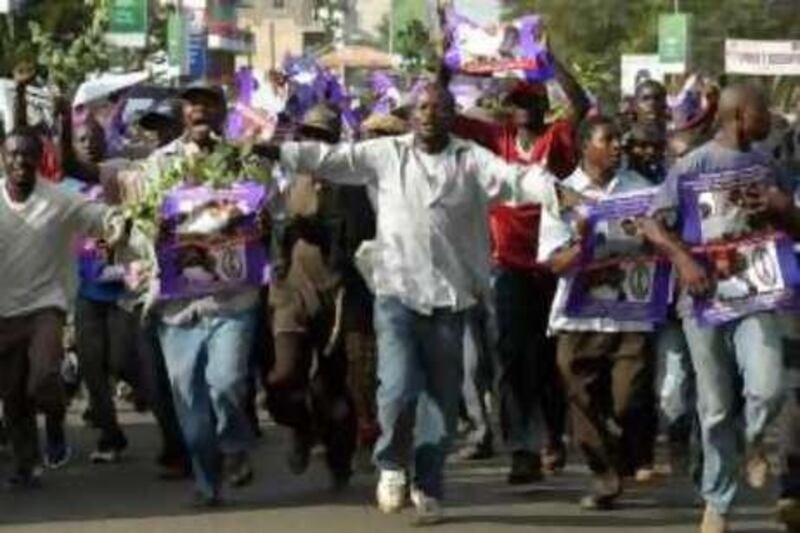 Kenyan's in Kisumu, Western Kenya, Wednesday Nov. 5, 2008, celebrates the victory of president-elect Barack Obama in the American presidential election. Barack Obama's Kenyan relatives and Africans across the continent celebrated his victory Wednesday, staying up all night or waking before dawn to cheer in America's first black president. (AP Photo/Riccardo Gangale) *** Local Caption ***  XRG118_APTOPIX_Kenya_Obama_Election_Reax.jpg