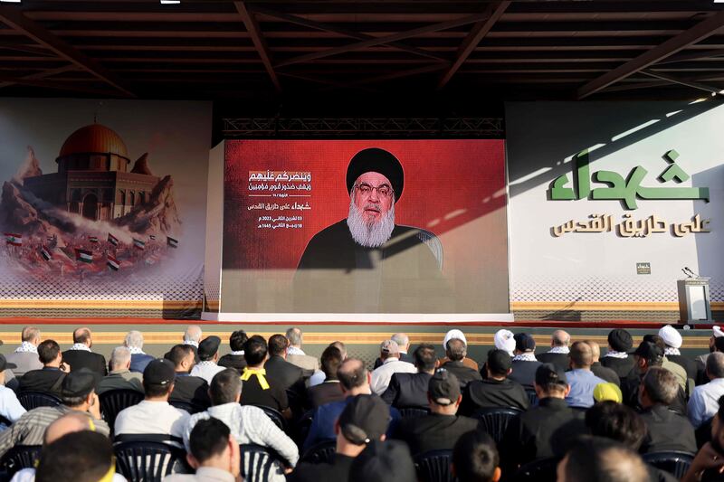 Hezbollah supporters watch a televised speech by the group's leader Hassan Nasrallah in Beirut's southern suburbs on Friday. AFP