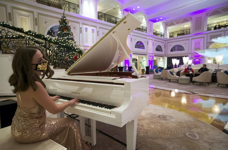 Ras Al Khaimah, United Arab Emirates: A pianist entertaining few guests at Waldorf Astoria, Al Hamra Island, RAK.  Leslie Pableo for The National