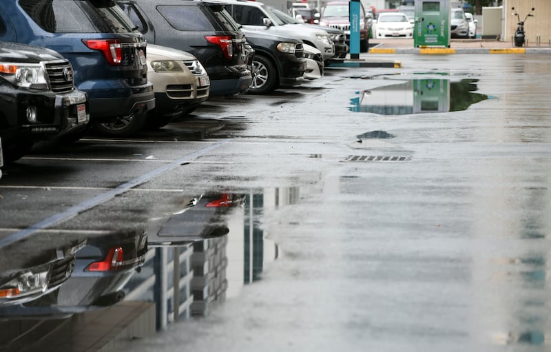 Large puddles in a residential neighbourhood of Abu Dhabi. Khushnum Bhandari / The National
