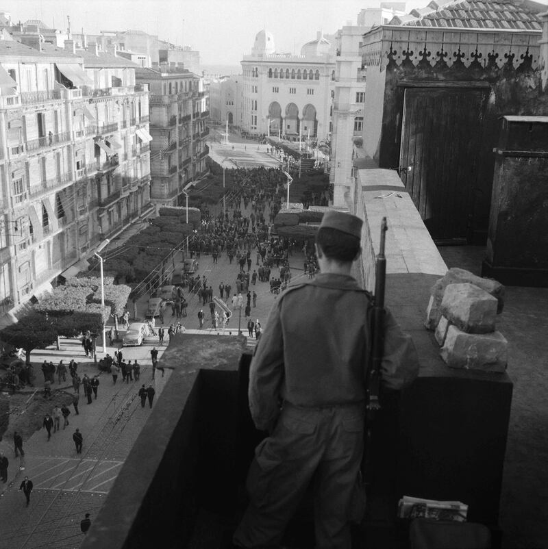 A soldier with forces supporting French rule in the North African country stands guard on a roof in Algiers in January 1960, during the Algerian war. AFP