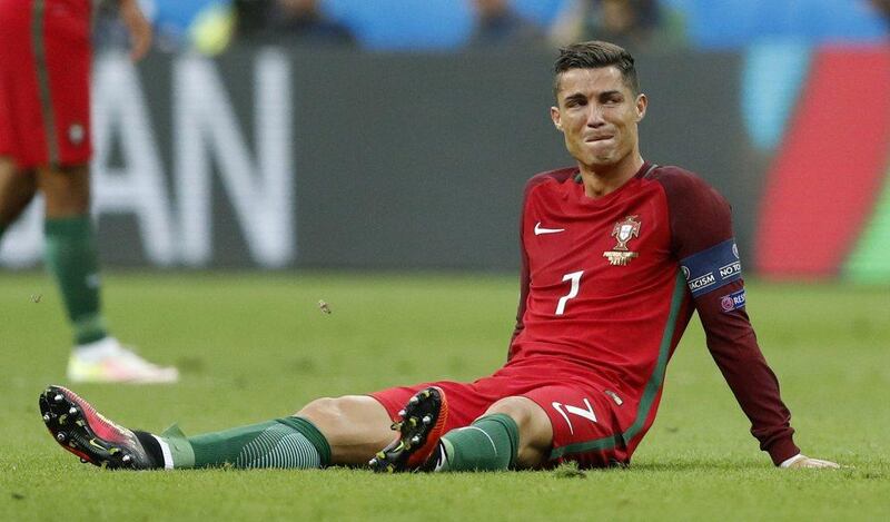 Portugal’s Cristiano Ronaldo reacts after sustaining a injury during the Uefa Euro 2016 Final at the Stade de France, 10 July 2016. Carl Recine / Reuters