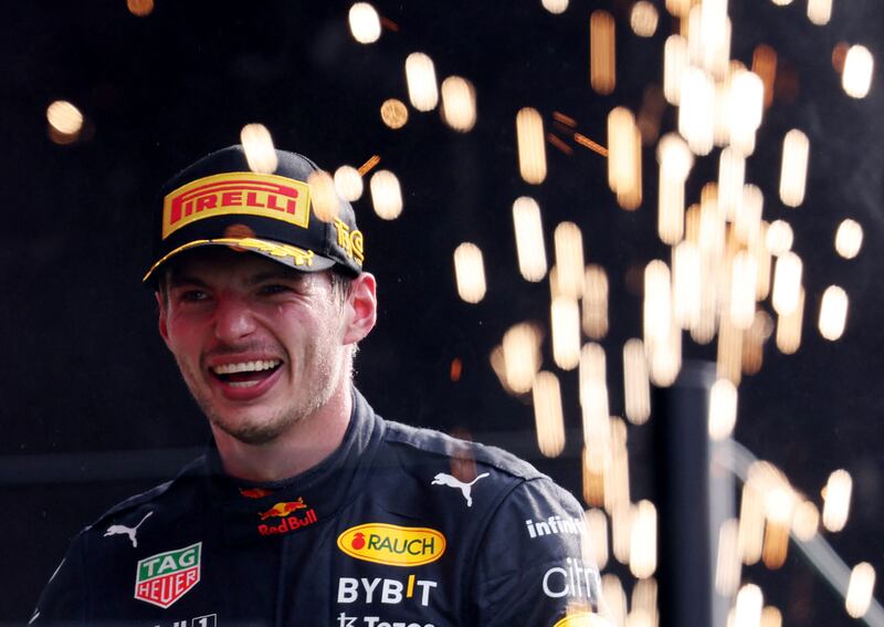 Red Bull's Max Verstappen celebrates on the podium after winning the Dutch Grand Prix on September 4, 2022. Reuters