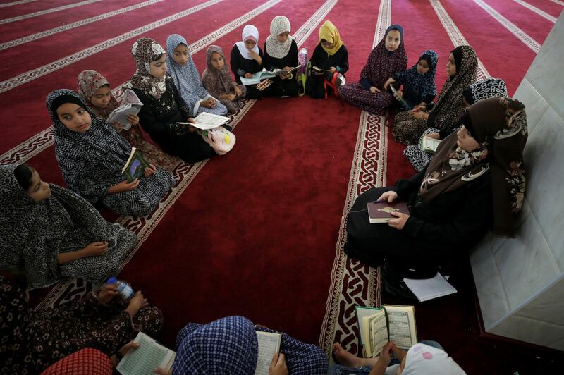 Girls attend a Koran class as Palestinians ease the Covid-19 restrictions, in a mosque in Gaza City. Reuters