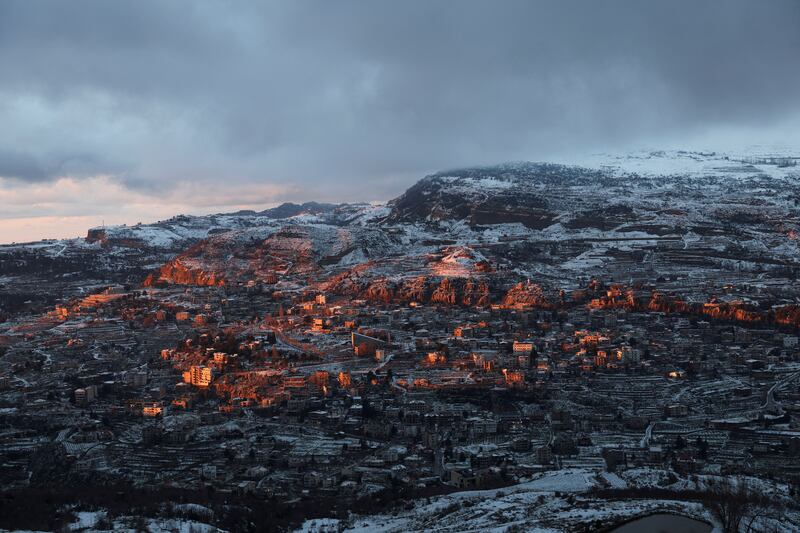 Snow-covered trees and houses in Faraya as seen from Kfardebian, Lebanon. Reuters