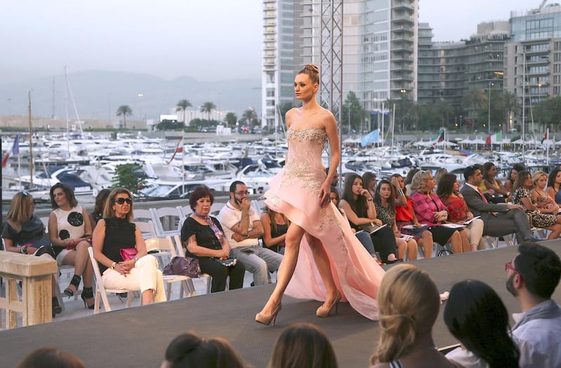 A model displays a creation by the Emirati designer Mona al-Mansouri of her Spring-Summer 2015 fashion show during the summer fashion week at Saint George Yacht Club in Beirut, Lebanon, Tuesday, May 19, 2015. Hussein Malla / AP photo