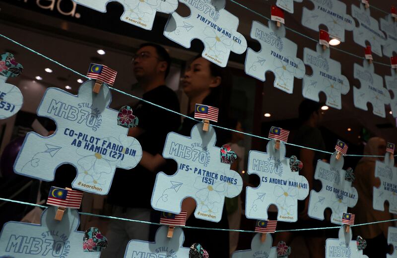 Names of crew members and passengers of the missing Malaysia Airlines flight MH370 are displayed during a remembrance event marking the 10th anniversary of the plane's disappearance, in Subang Jaya, Malaysia. Reuters